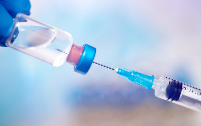 close-up-on-vaccine-and-medical-syringe-FQC8XNL
